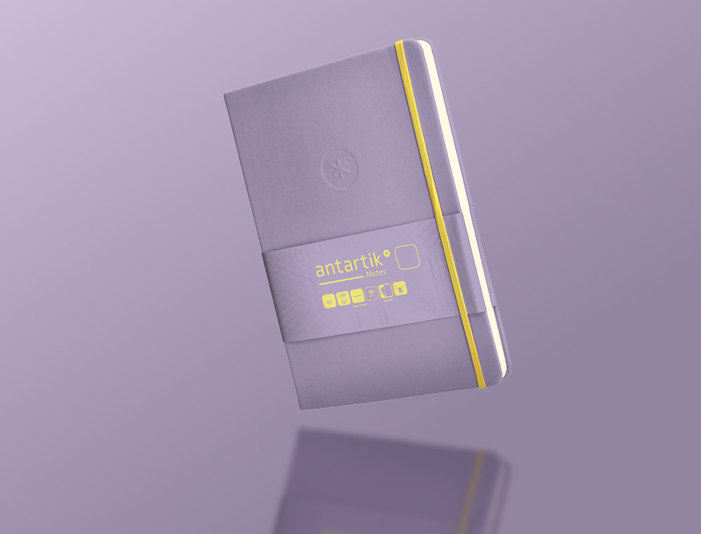 CADERNO COM ELASTICO ANTARTIK NOTES CAPA DURA A5 LISO ROXO E AMARELO 100 FOLHAS 80 GR FSC